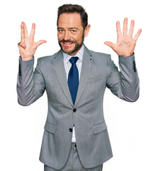 Middle age man wearing business clothes showing and pointing up with fingers number nine while smiling confident and happy.