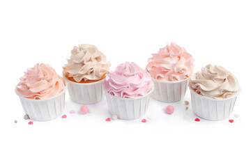 Tasty cupcakes with cream and sprinkles isolated on white