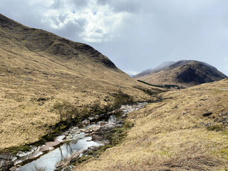 A view of the Scotland Countryside near the Glencoe Mountains on a sunny day