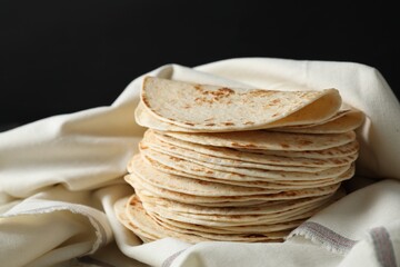 Stack of tasty homemade tortillas on table
