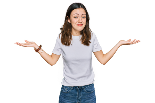 Young beautiful woman wearing casual white t shirt clueless and confused expression with arms and hands raised. doubt concept.