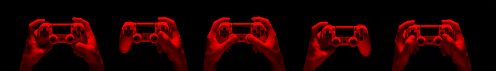 Hyman hands holding video game gamepad in neon lights isolated on a black