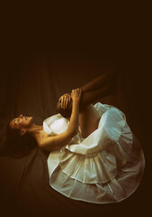 dancer lying on the floor with her legs up in a desolate attitude III © livcool