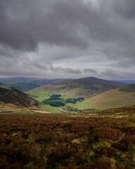 Moody Irish landscape with hills in the background during cloudy weather