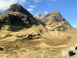 A view of the Scotland Countryside near the Glencoe Mountains on a sunny day
