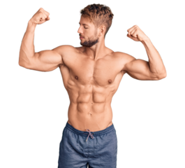 Young caucasian man standing shirtless showing arms muscles smiling proud. fitness concept.