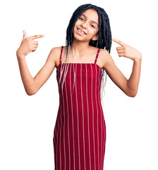 Cute african american girl wearing casual clothes looking confident with smile on face, pointing oneself with fingers proud and happy.