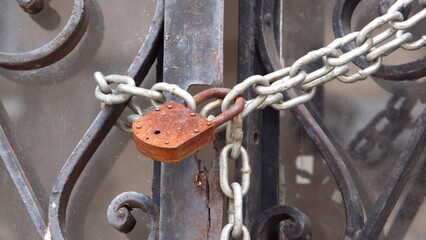Old, rusted padlock on the door of a mausoluem in La Recoleta Cemetery in Buenos Aires, Argentina