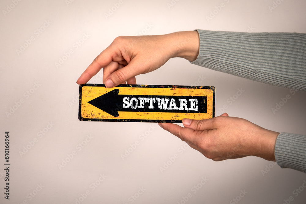 Canvas Prints software. arrow with text in woman's hand on white background