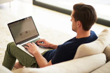 Sofa, screen and man with laptop in home for information, freelance project and digital report....