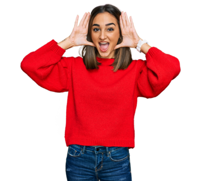 Beautiful brunette woman wearing casual winter sweater smiling cheerful playing peek a boo with hands showing face. surprised and exited