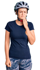 Beautiful caucasian woman wearing bike helmet touching mouth with hand with painful expression because of toothache or dental illness on teeth. dentist