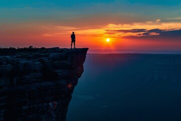 Silhouette standing cliff sunrise majestic glow top nature landscape morning outdoors horizon sky sunlight dawn beauty scenic edge dramatic serene panoramic framed