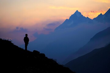 Fototapeta premium Silhouette mountain zenith framed evening sky solitary observer nature's grandeur