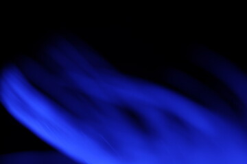 Purple feather in macro, bird feather, dark colourful background 