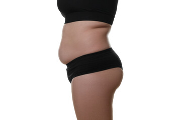 Woman with excessive belly fat on white background, closeup. Overweight problem