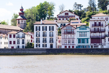 Traditional houses of Ciboure with the river Nivelle on the foreground.