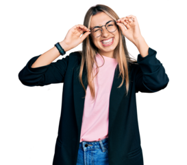 Hispanic young woman wearing elegant jacket and glasses winking looking at the camera with sexy expression, cheerful and happy face.