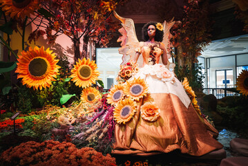 Vibrant, themed display with mannequin in elaborate gown and butterfly wings captured in Las Vegas...