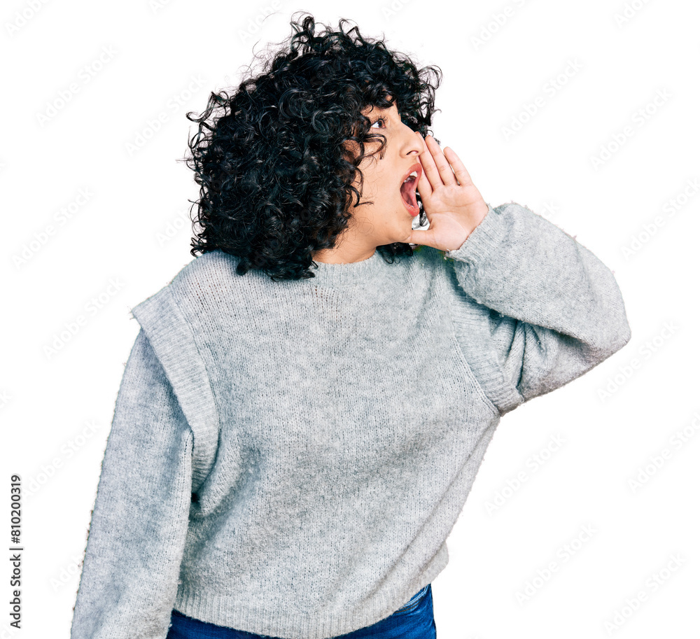 Canvas Prints Young middle east girl wearing casual clothes shouting and screaming loud to side with hand on mouth. communication concept.