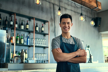 Happy, portrait and business owner of bar with pride in hospitality, service or waiter with arms crossed. Entrepreneur, smile and bartender in restaurant and professional server working with alcohol