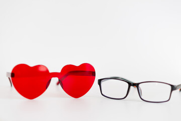 A pair of red heart shaped sunglasses