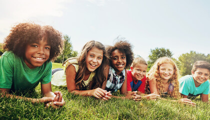 Friends, grass and portrait of children in park for outdoor adventure, bonding or school trip. Diversity, student and kids with smile in nature for connection, friendship or holiday in Washington dc