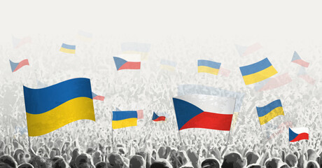 People waving flag of Czech Republic and Ukraine, symbolizing Czech Republic solidarity for Ukraine.