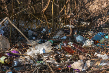 Illegal garbage dump in nature. Dirty garbage polluting the environment