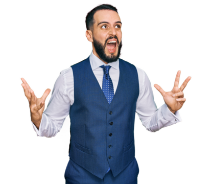 Young man with beard wearing business vest crazy and mad shouting and yelling with aggressive expression and arms raised. frustration concept.