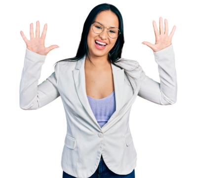 Beautiful hispanic woman with nose piercing wearing business jacket and glasses showing and pointing up with fingers number ten while smiling confident and happy.