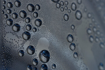 macro-photography of condensed water drops inside a bottle.