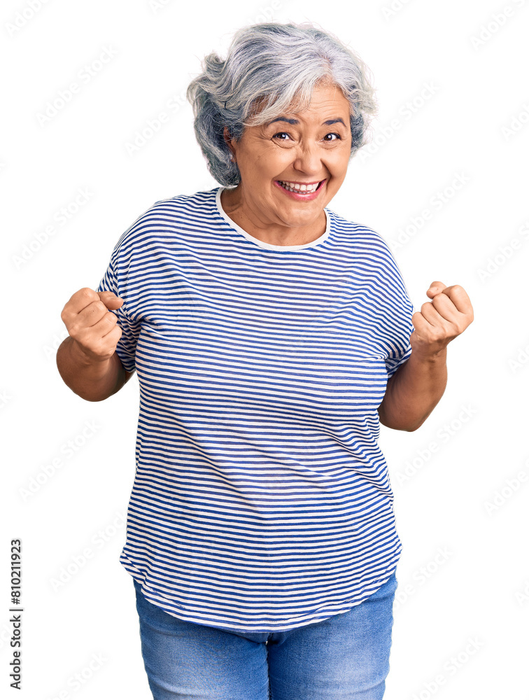 Sticker Senior woman with gray hair wearing casual striped clothes very happy and excited doing winner gesture with arms raised, smiling and screaming for success. celebration concept.