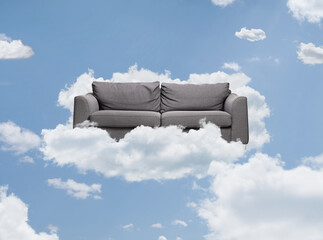 Grey sofa floating on a cloud