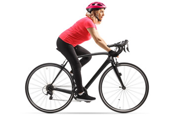 Woman in sportswear riding a bicycle with a helmet
