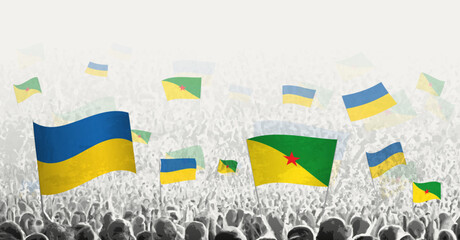 People waving flag of French Guiana and Ukraine, symbolizing French Guiana solidarity for Ukraine.