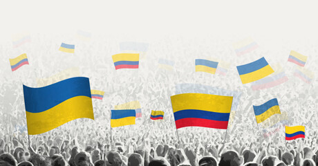 People waving flag of Colombia and Ukraine, symbolizing Colombia solidarity for Ukraine.