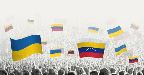 People waving flag of Venezuela and Ukraine, symbolizing Venezuela solidarity for Ukraine.