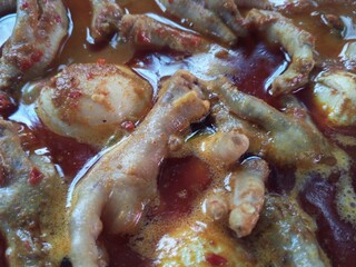 Ready to eat. Chicken feet and spicy egg rendang sauce or 