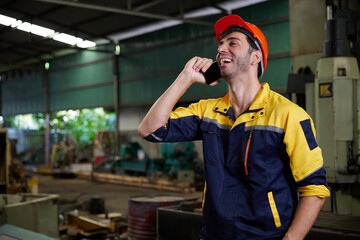 engineer or technician talking and calling on smartphone in the factory