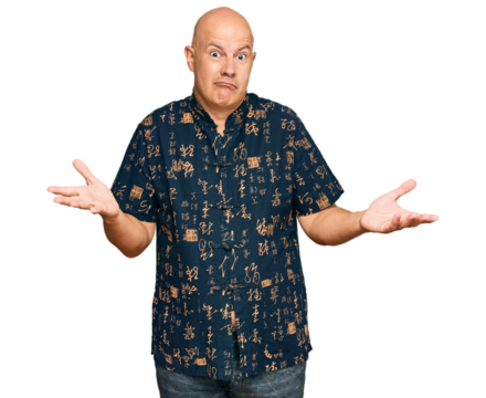Middle age bald man wearing casual clothes clueless and confused expression with arms and hands raised. doubt concept.