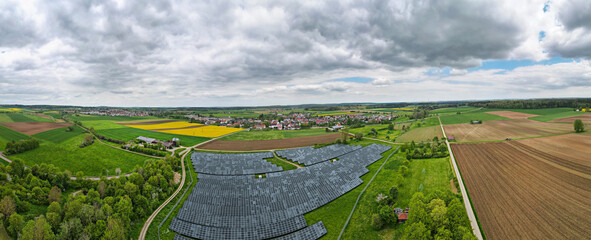 Aerial view of Photovoltaic park in Berghülen, south Germany, Baden-Württemberg, Europe. Summer time.
