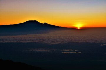 Silhouette of Kilimanjaro as seen at dawn during the ascent from Rhino Point to the top of Mount...