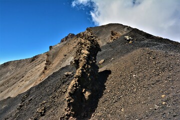 The ridge of Mount Meru, a dormant stratovolcano and the second highest mountain in Tanzania (4562 m), as seen during the morning ascent from Rhino Point (Arusha National Park, Tanzania)