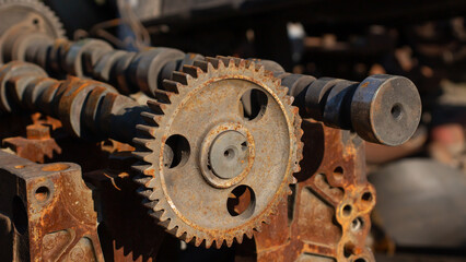 engine camshaft. rusty used engine spare parts on a metal receiver