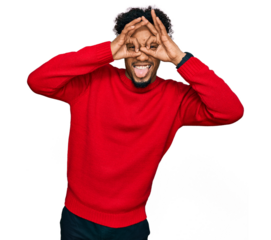 Young african american man with beard wearing casual winter sweater doing ok gesture like binoculars sticking tongue out, eyes looking through fingers. crazy expression.