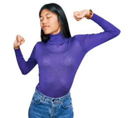 Beautiful young asian woman wearing casual clothes stretching back, tired and relaxed, sleepy and yawning for early morning