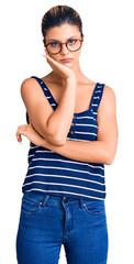 Young beautiful woman wearing casual clothes and glasses thinking looking tired and bored with...