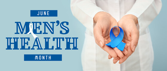 Female urologist with blue ribbon on color background, closeup. Prostate cancer concept