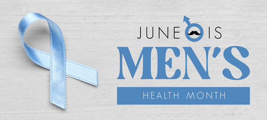 Blue awareness ribbon on light wooden background. Prostate cancer concept